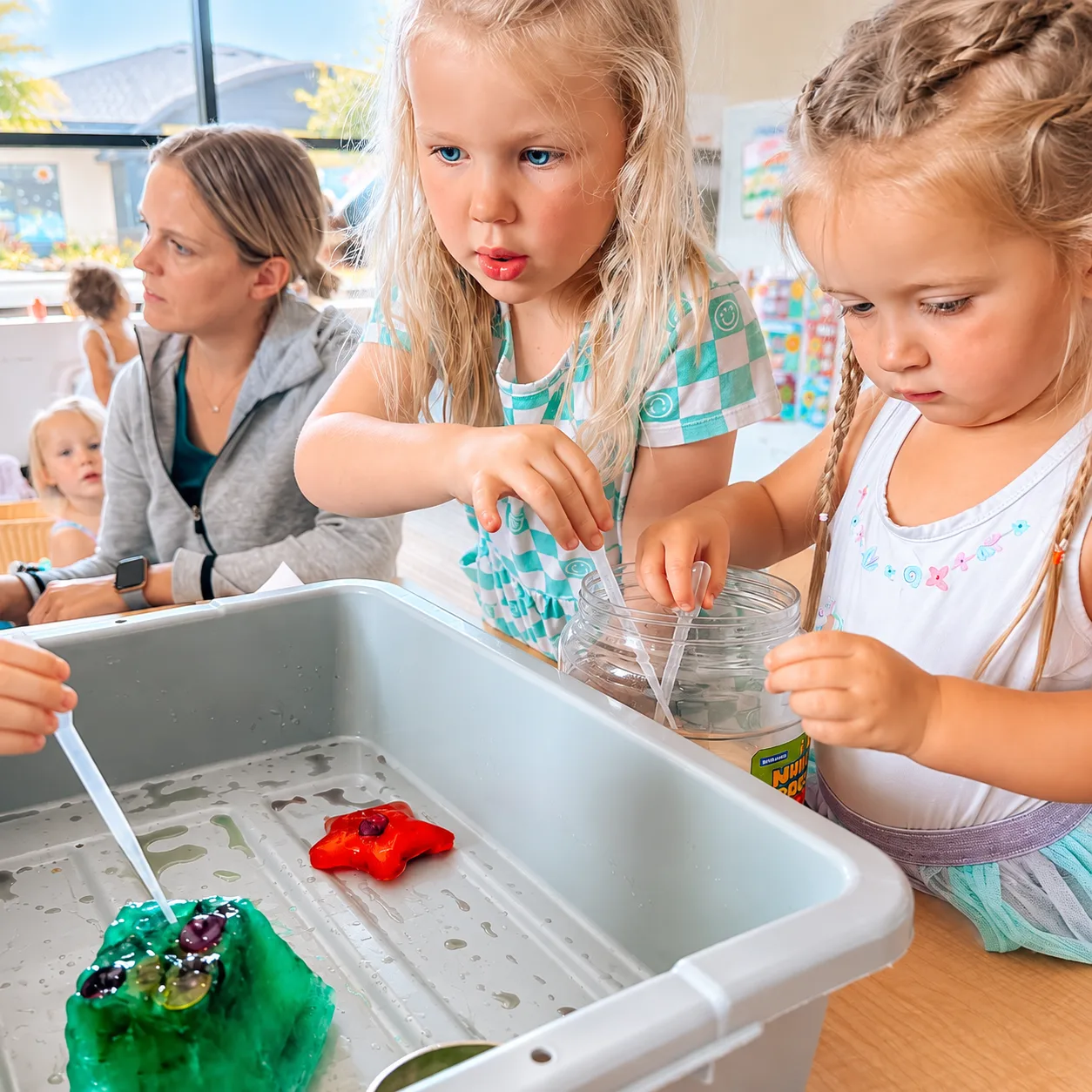 Preschoolers using droppers in a hands-on science activity